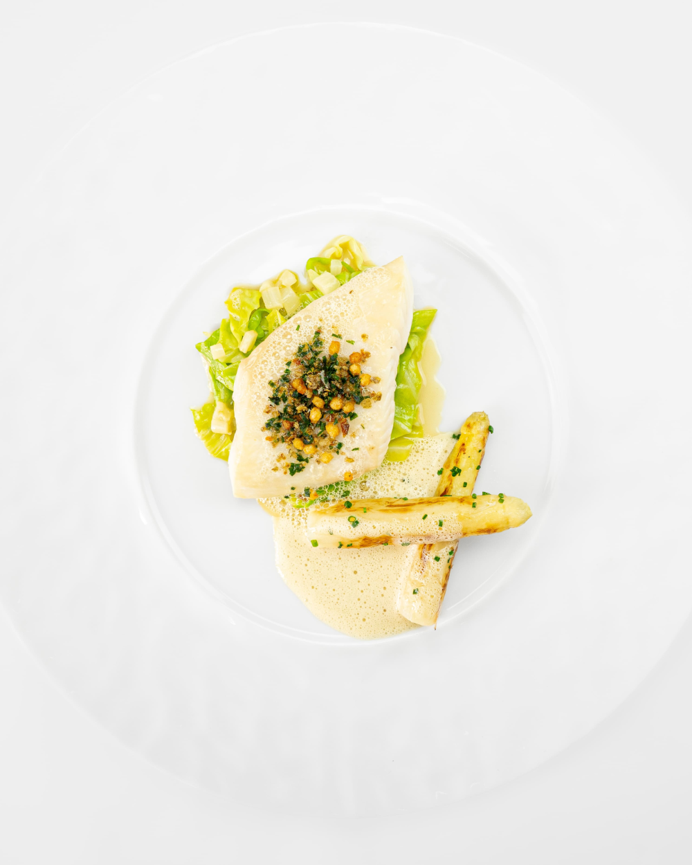 Steamed John Dory with white asparagus, served with its cooking juices