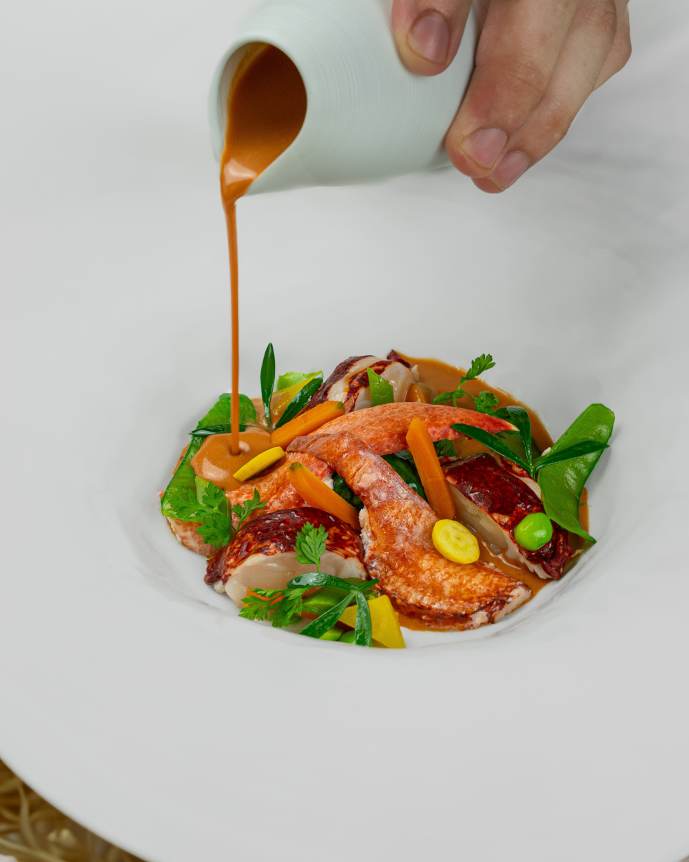 Chilled potage of lobster and young vegetables with lobster coral